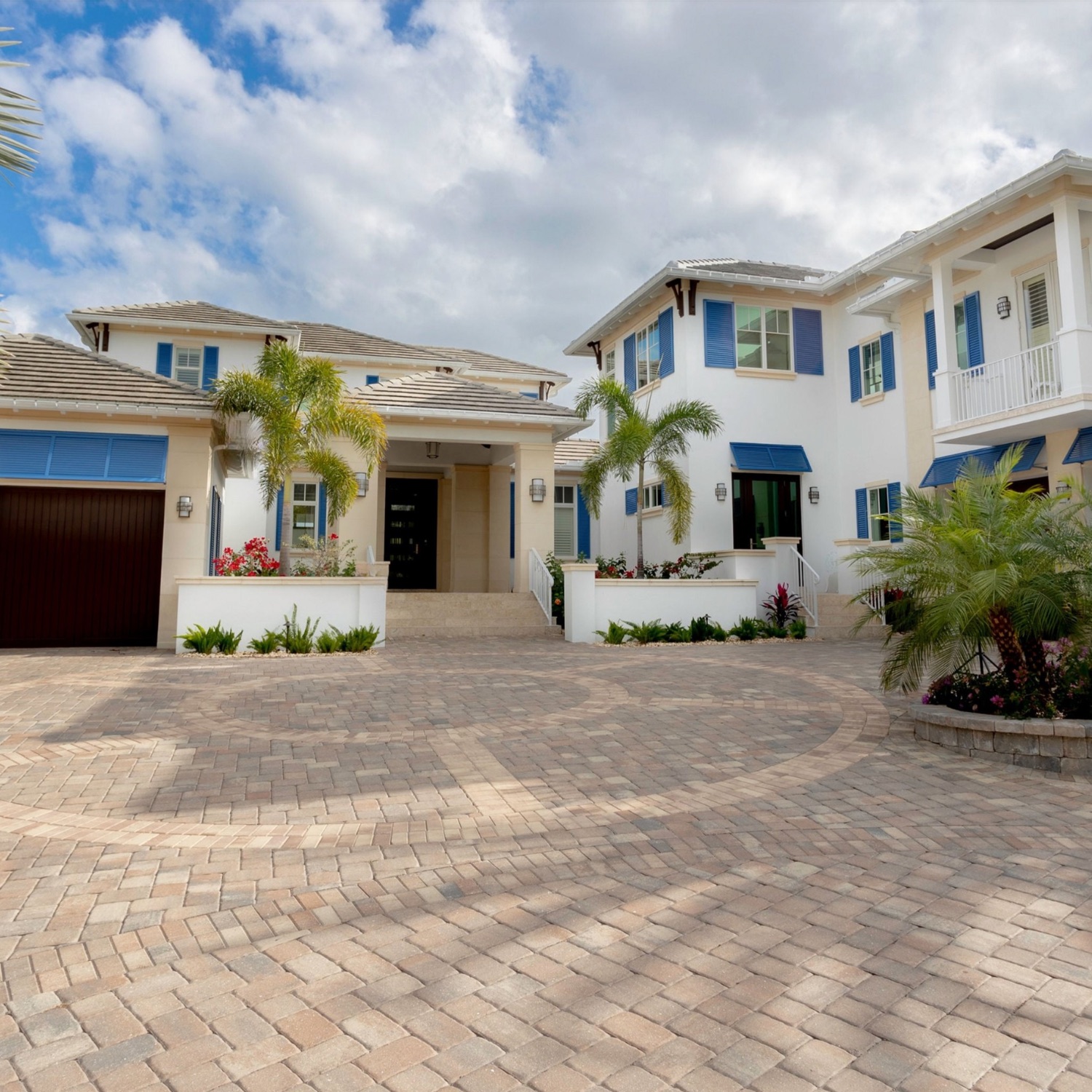 Blue exterior shutters on a cream coastal home