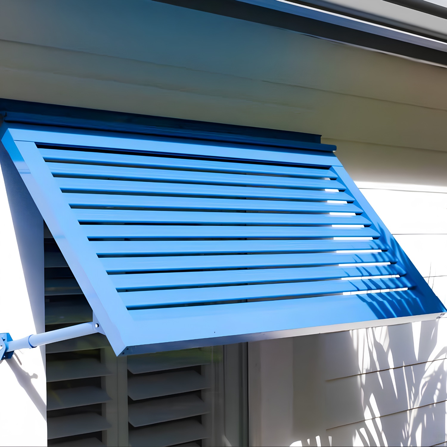 Blue Bahama shutter angled above a window on support arms