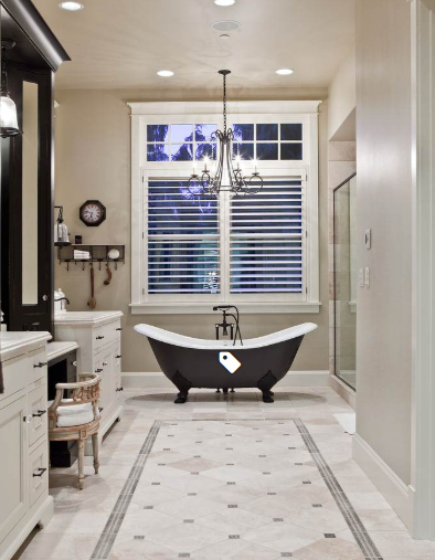 White plantation shutters above a black clawfoot bathtub in a classic Naples bathroom