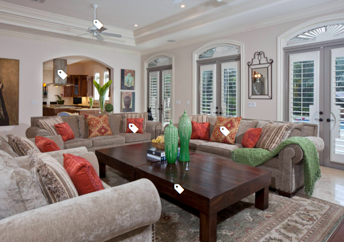 White plantation shutters in arched windows of a Naples living room with Mediterranean architecture